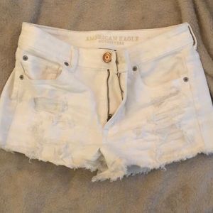 White ripped shorts